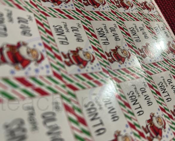 Stack of cartoon Santa gift tags