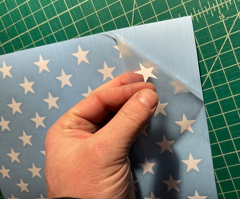 Vinyl star stencil on cornhole board