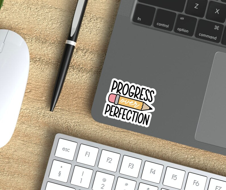 Progress over Perfection sticker in black and yellow lettering with pencil graphic