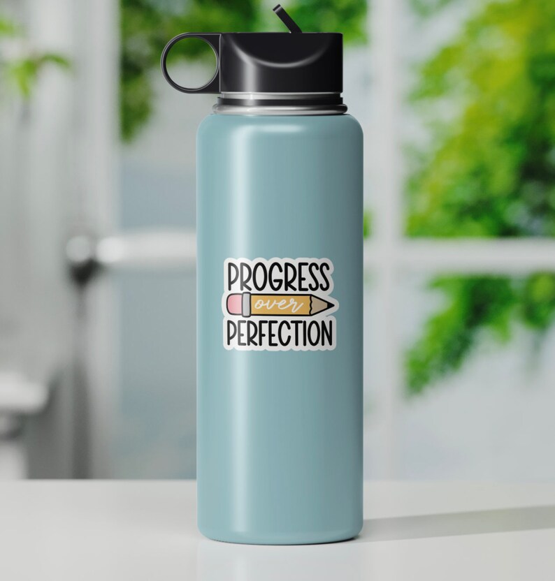 Progress Over Perfection sticker on light blue water bottle with black lid