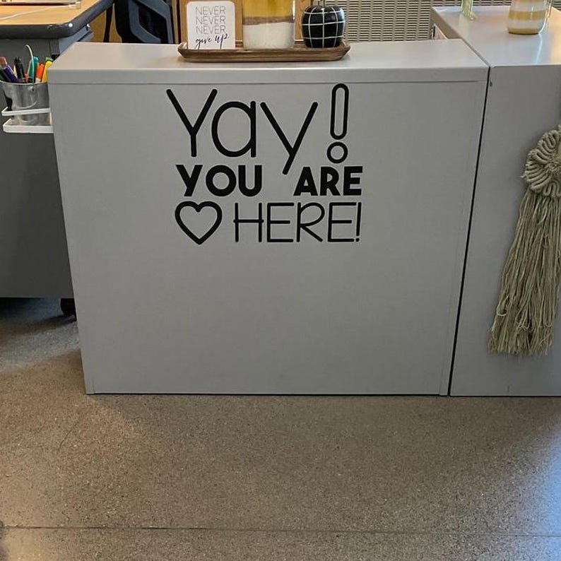Yay You Are HERE! decal on gray counter