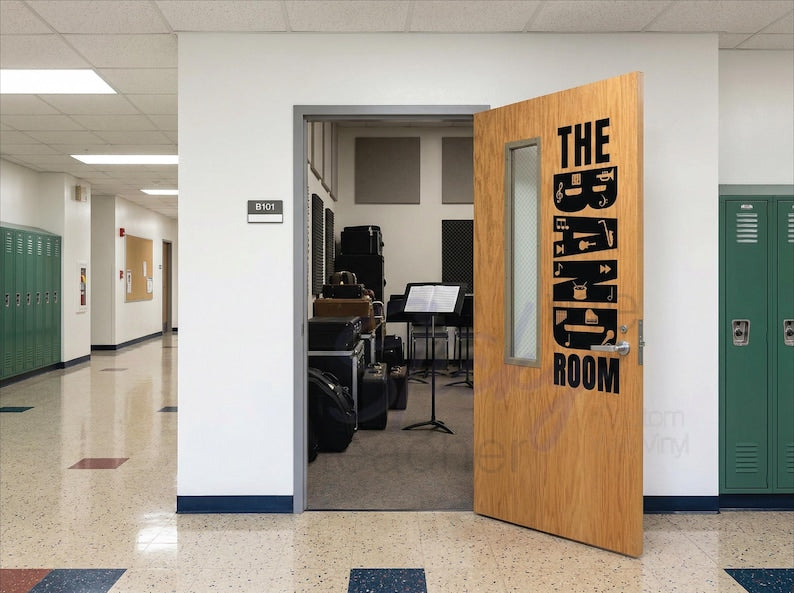 The Band Room vertical wall vinyl decal in black on white wall beside classroom door with musical instruments visible