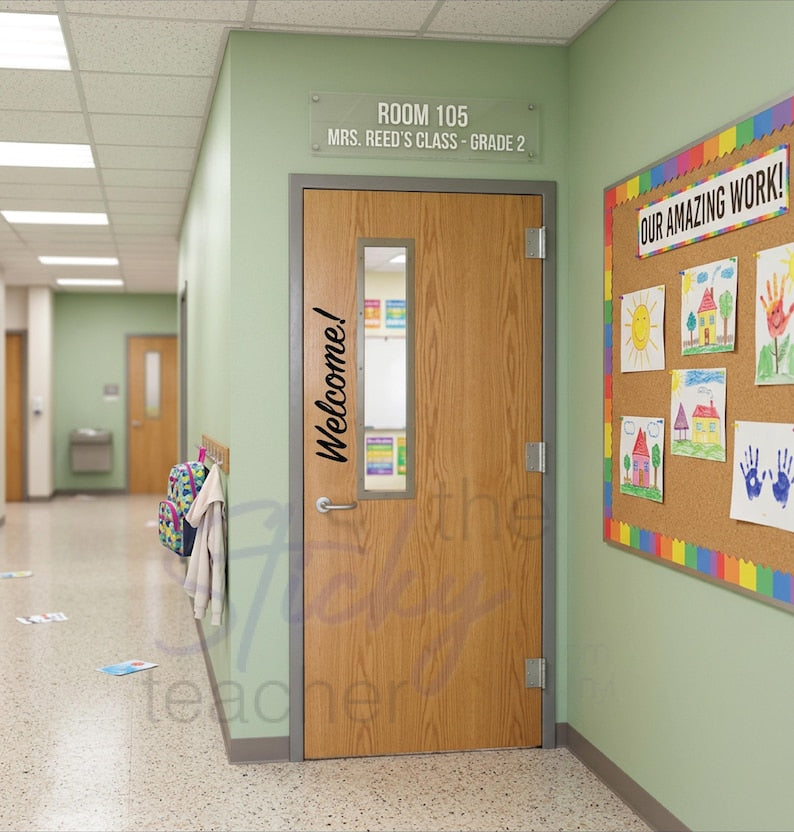 Welcome! classroom door vinyl decal on wooden door with student artwork visible