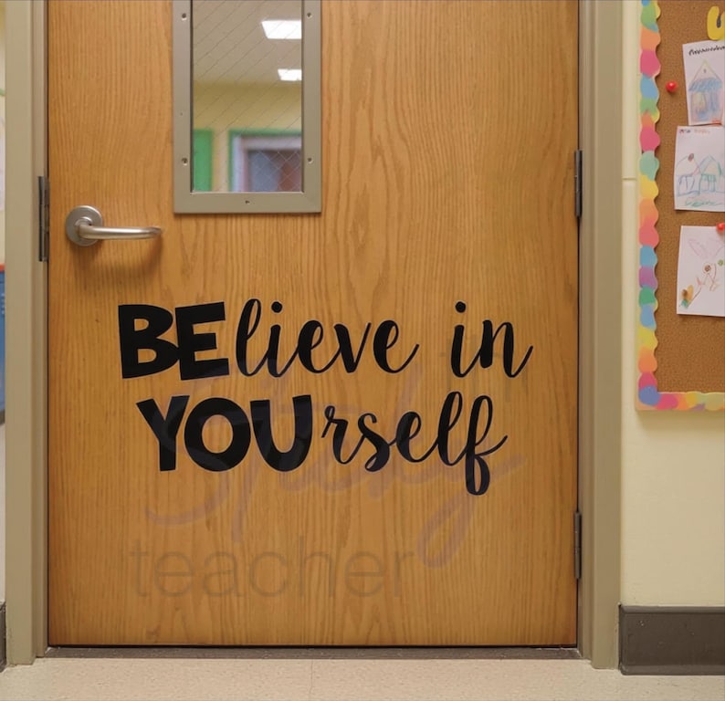 BElieve in YOUrself decal on wooden classroom door with window