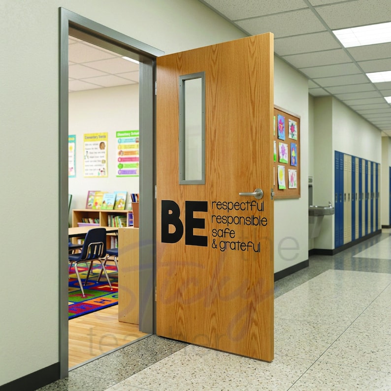 BE respectful responsible safe grateful classroom door vinyl decal on light wood door with glass window