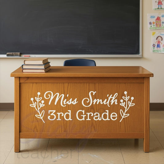 Teacher name desk decal reading Miss Smith 3rd Grade in white vinyl on wooden teacher desk