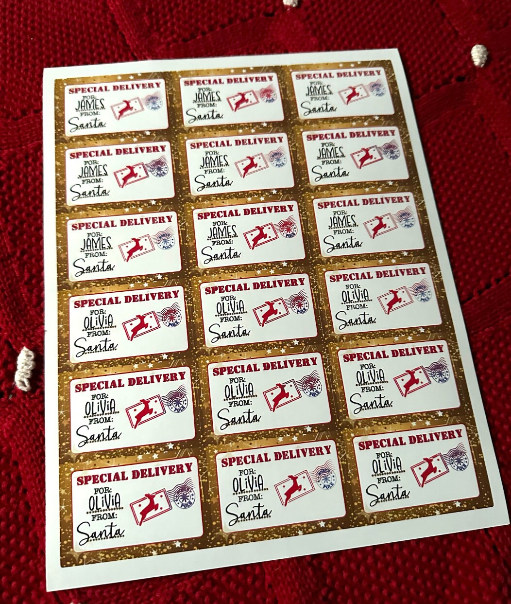Sheet of gold reindeer gift tags for James and Olivia