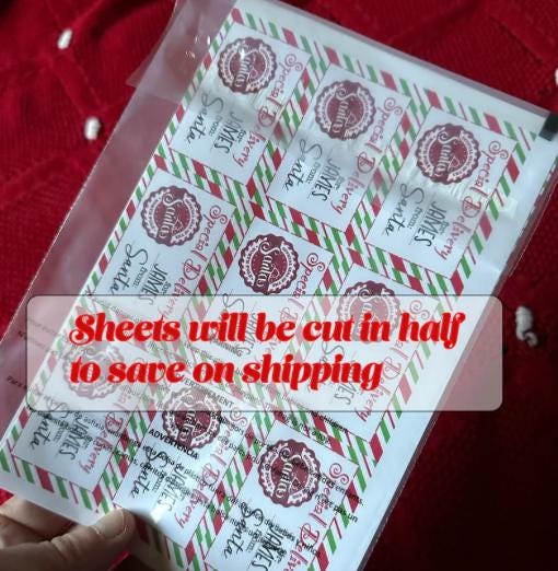 Santa label sheet cut in half for shipping